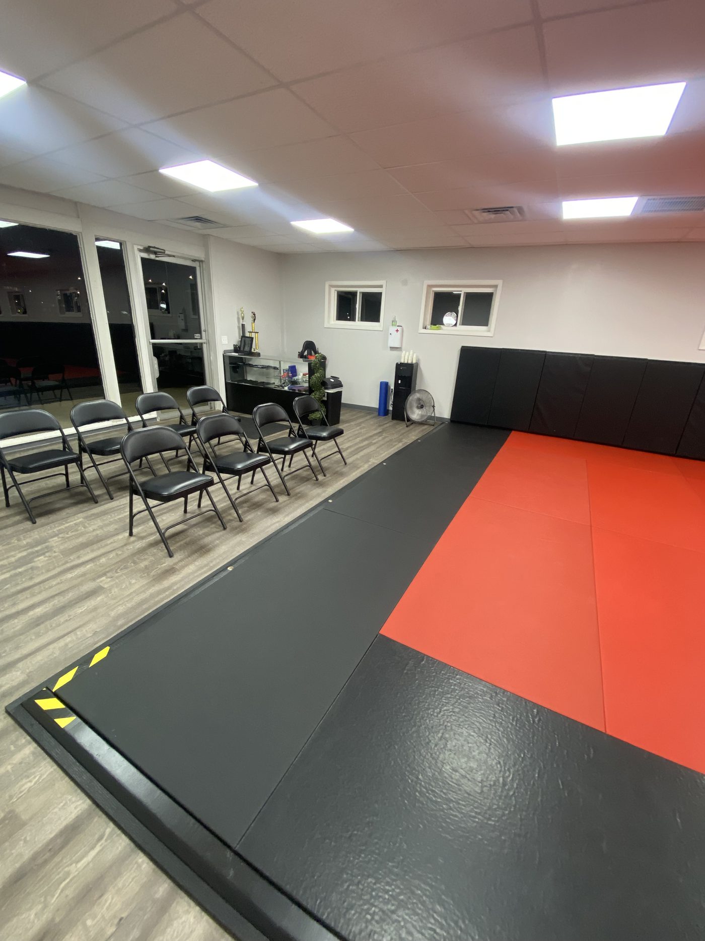 Seating along the edge of the mat at Northstar Jiu Jitsu where visitors and parents can watch a class