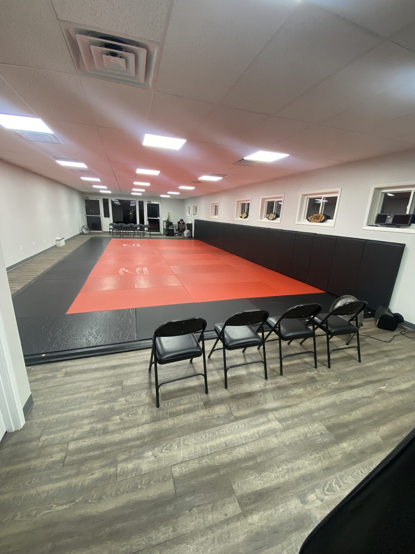 The open mat space at Northstar Jiu Jitsu in Eau Claire, where the Rising Stars kids classes train